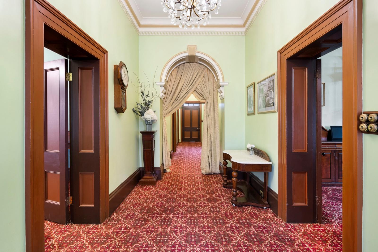 Arched hallway with crystal chandelier